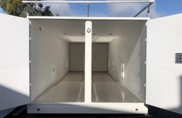 Interior of a MagLok relocatable magazine with doors open, showing the clean internal storage space and dividing wall